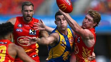 Ultra-competitiveness is what sets Elliot Yeo (centre) apart for West Coast, Jeremy McGovern says. (Dave Hunt/AAP PHOTOS)